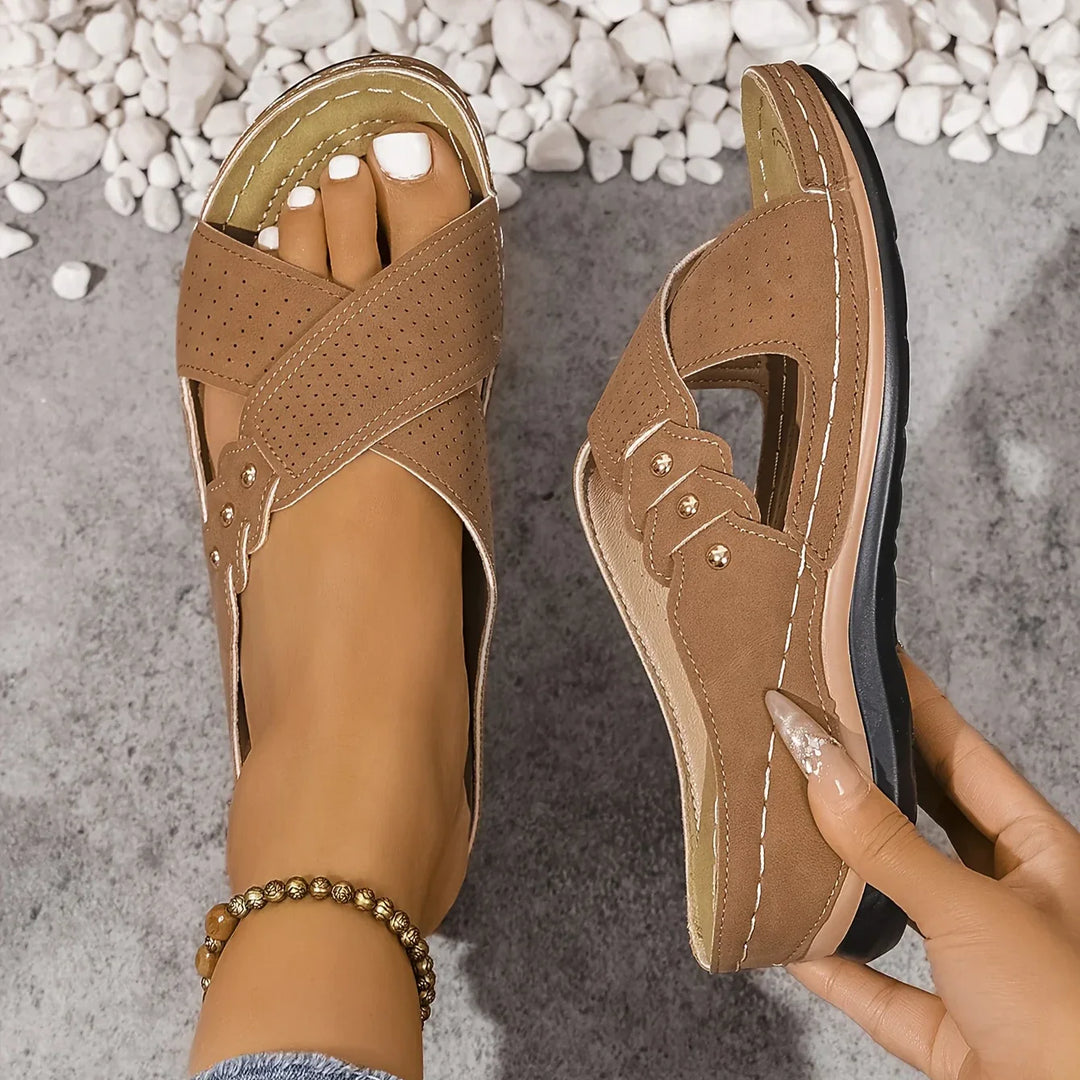 Overhead view of women's crossover strap wedge sandals highlighting open-toe and slip-on fit