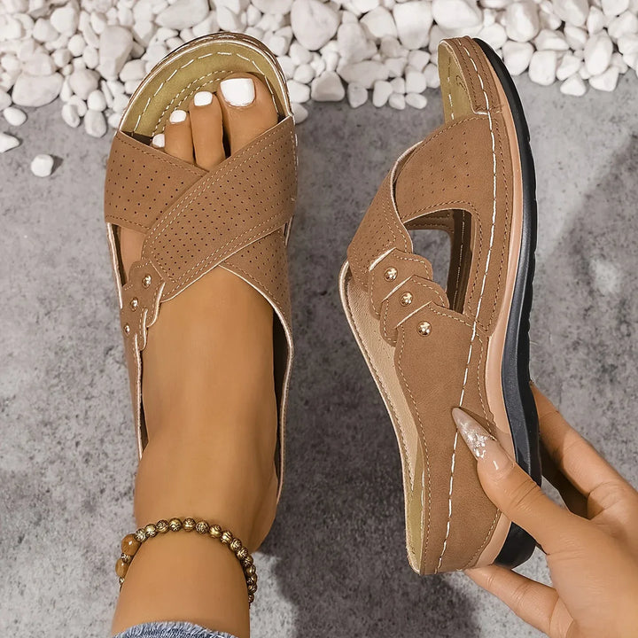 Overhead view of women's crossover strap wedge sandals highlighting open-toe and slip-on fit