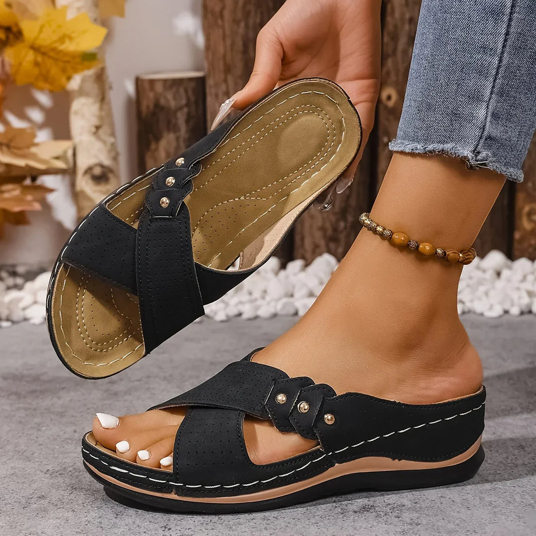 Women's slip-on wedge sandals modelled with casual summer outfit and ankle bracelet