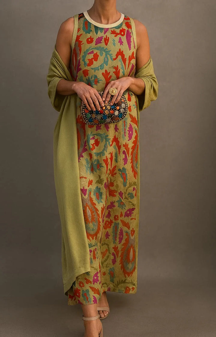Floral embroidered maxi dress with matching coat set featuring vibrant orange, teal, and fuchsia botanical patterns on beige base