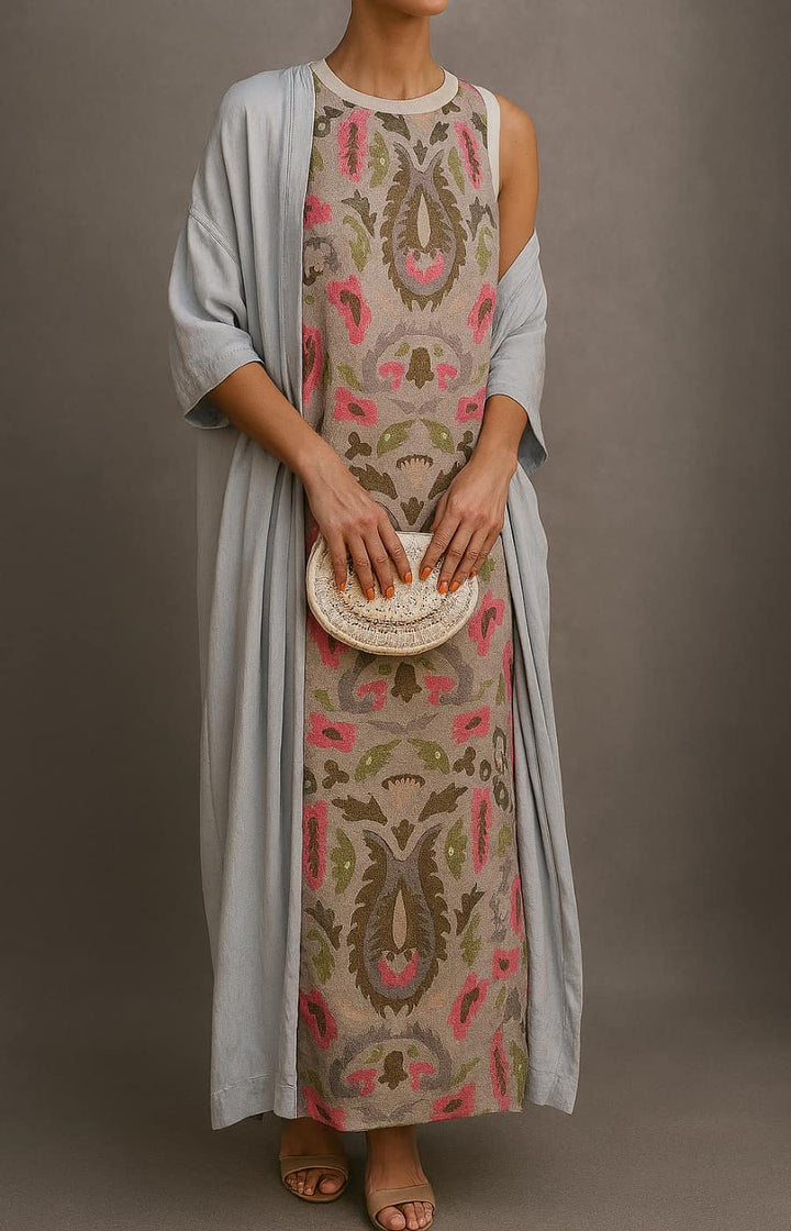 Full-length view of embroidered dress and coat set showing relaxed silhouette and ankle-length hem with botanical motifs