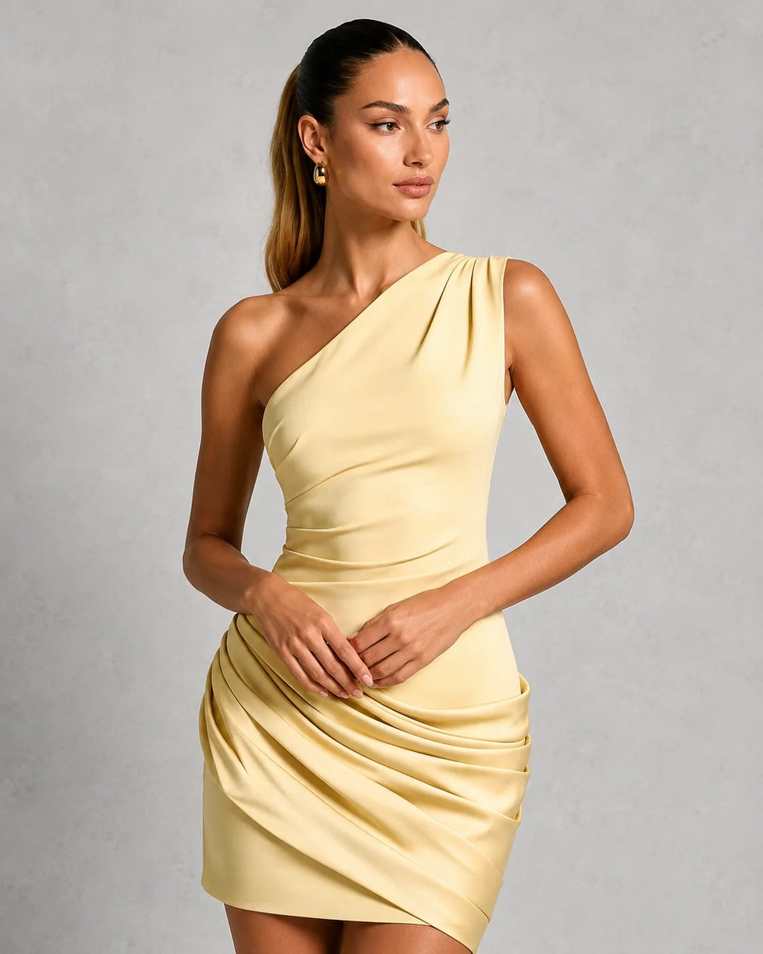 Detail shot of one shoulder neckline and bodice ruching on women's cocktail mini dress