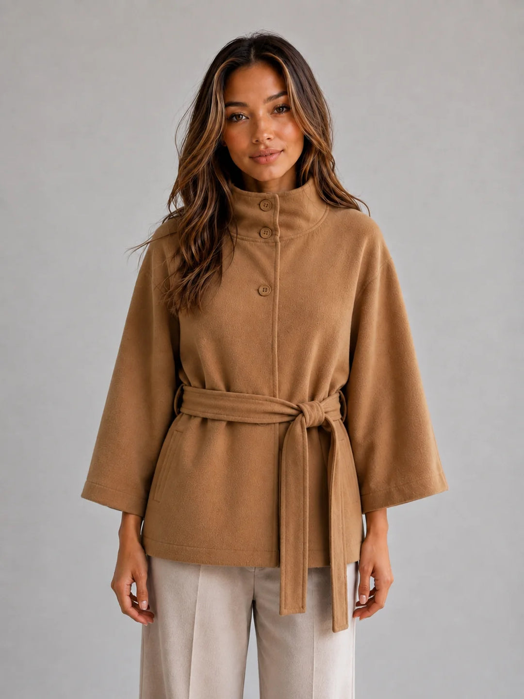 Women's Belted Cape Jacket – Stand Collar Wrap Coat in camel with adjustable waist belt and flowing cape sleeves