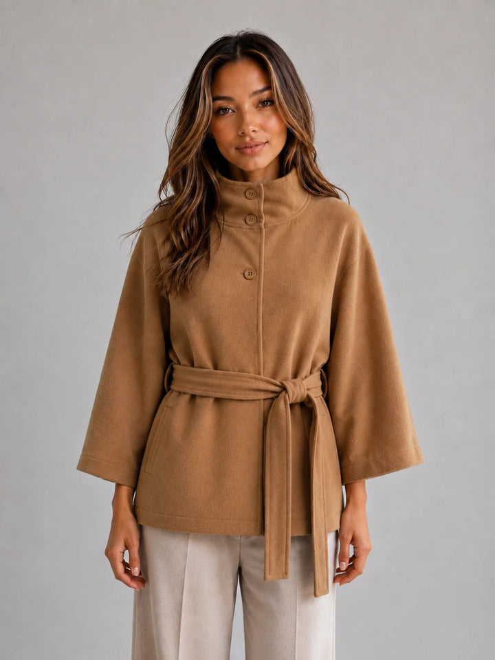 Women's Belted Cape Jacket – Stand Collar Wrap Coat in camel with adjustable waist belt and flowing cape sleeves