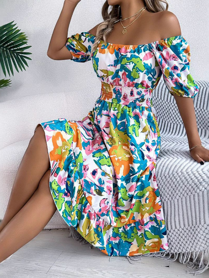 Full-length view of flowing midi dress with bold floral pattern and relaxed fit