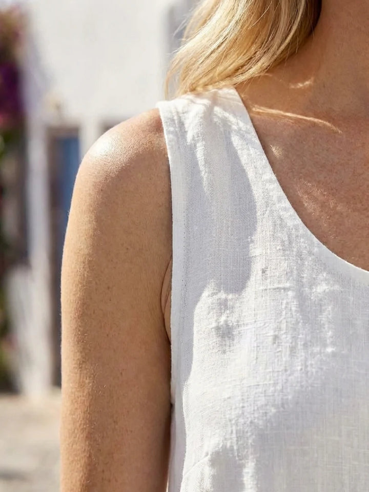 Side view of relaxed midi dress highlighting straight silhouette and ankle-grazing length
