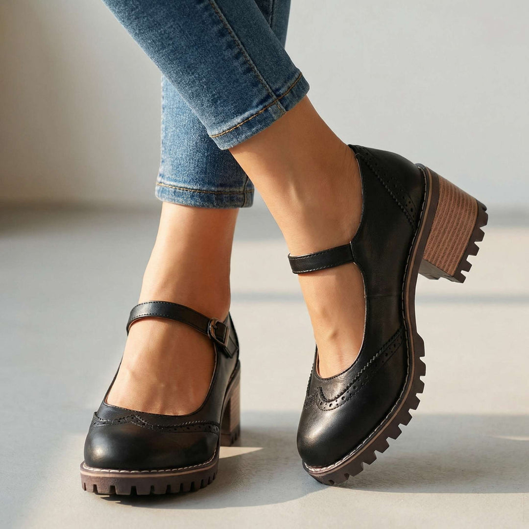 Women's T-strap block heel shoes in khaki shade with closed toe and vintage-inspired brogue perforations