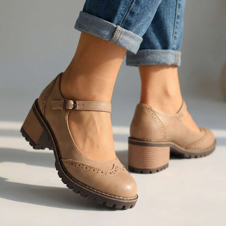 Women's T-strap block heel shoes styled with rolled denim jeans showing versatile everyday wearability