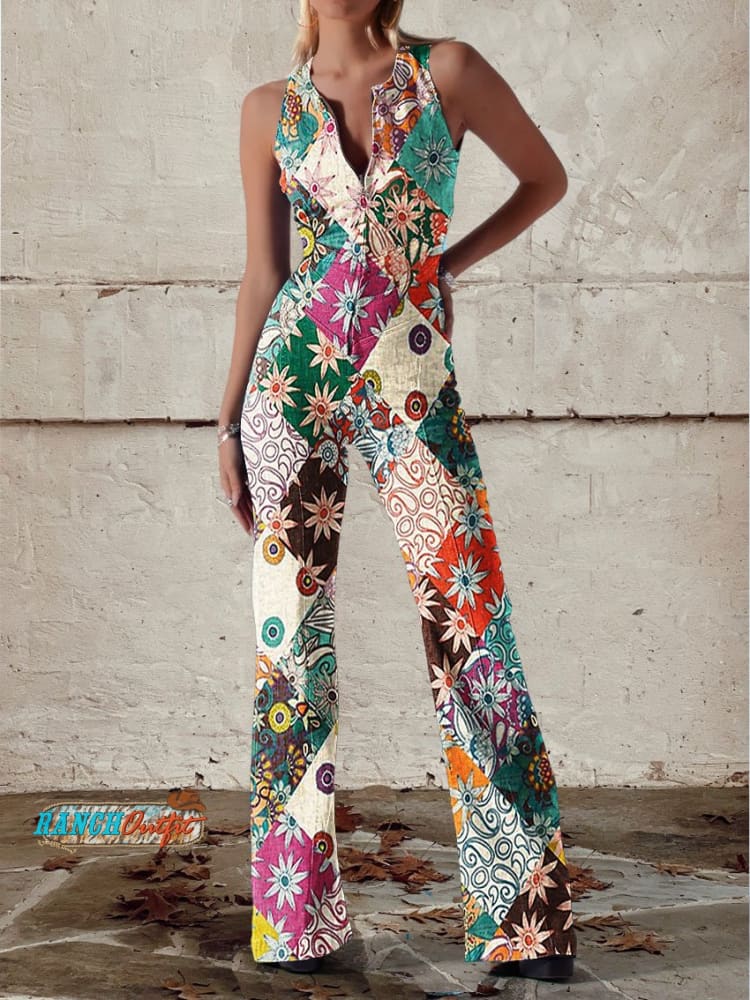 Floral patchwork jumpsuit with deep V-neckline and wide leg silhouette in vibrant mixed print