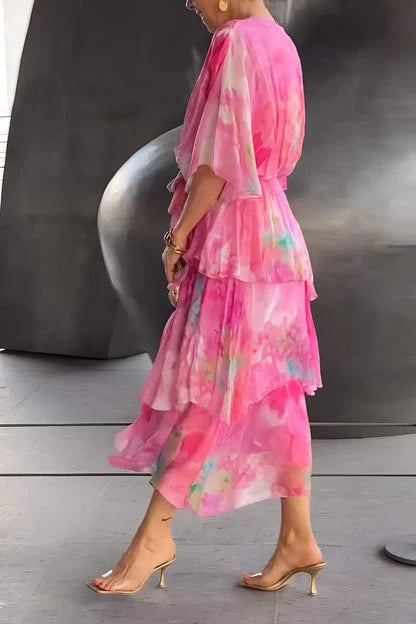 Full-length view of tie-dye tiered maxi dress with wrap bodice and ankle-length tiered skirt