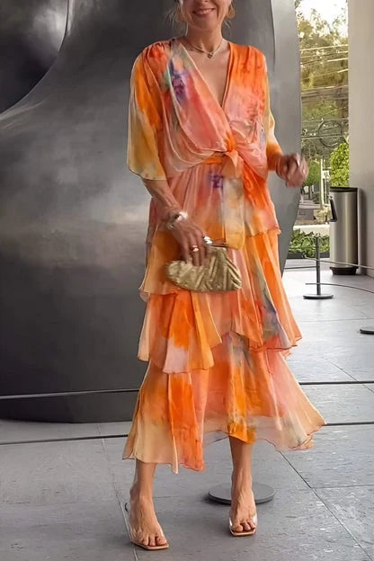 Detail shot of tie-dye tiered maxi dress showing sheer fabric and delicate ruffled edges