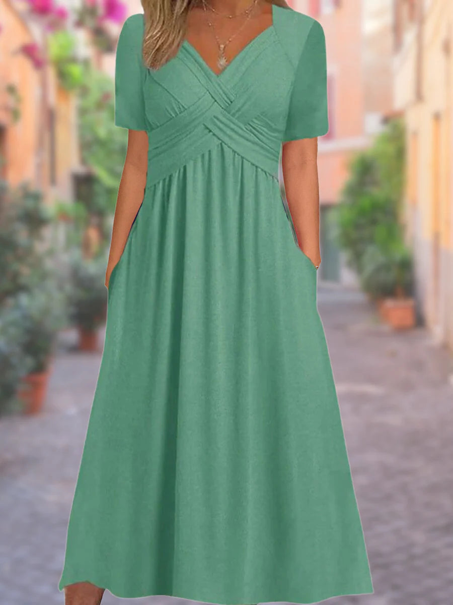 Side view of midi dress showing relaxed fit and practical pocket detail