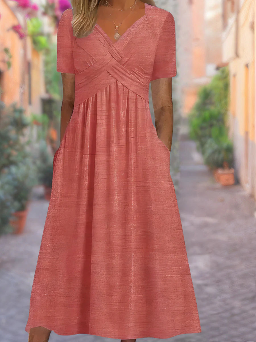 Full-length view of V-neck midi dress with short sleeves and mid-calf hemline
