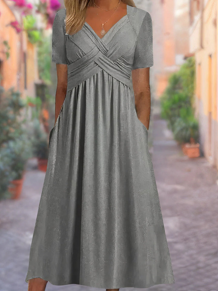 Back view of midi dress displaying draped skirt and comfortable relaxed fit