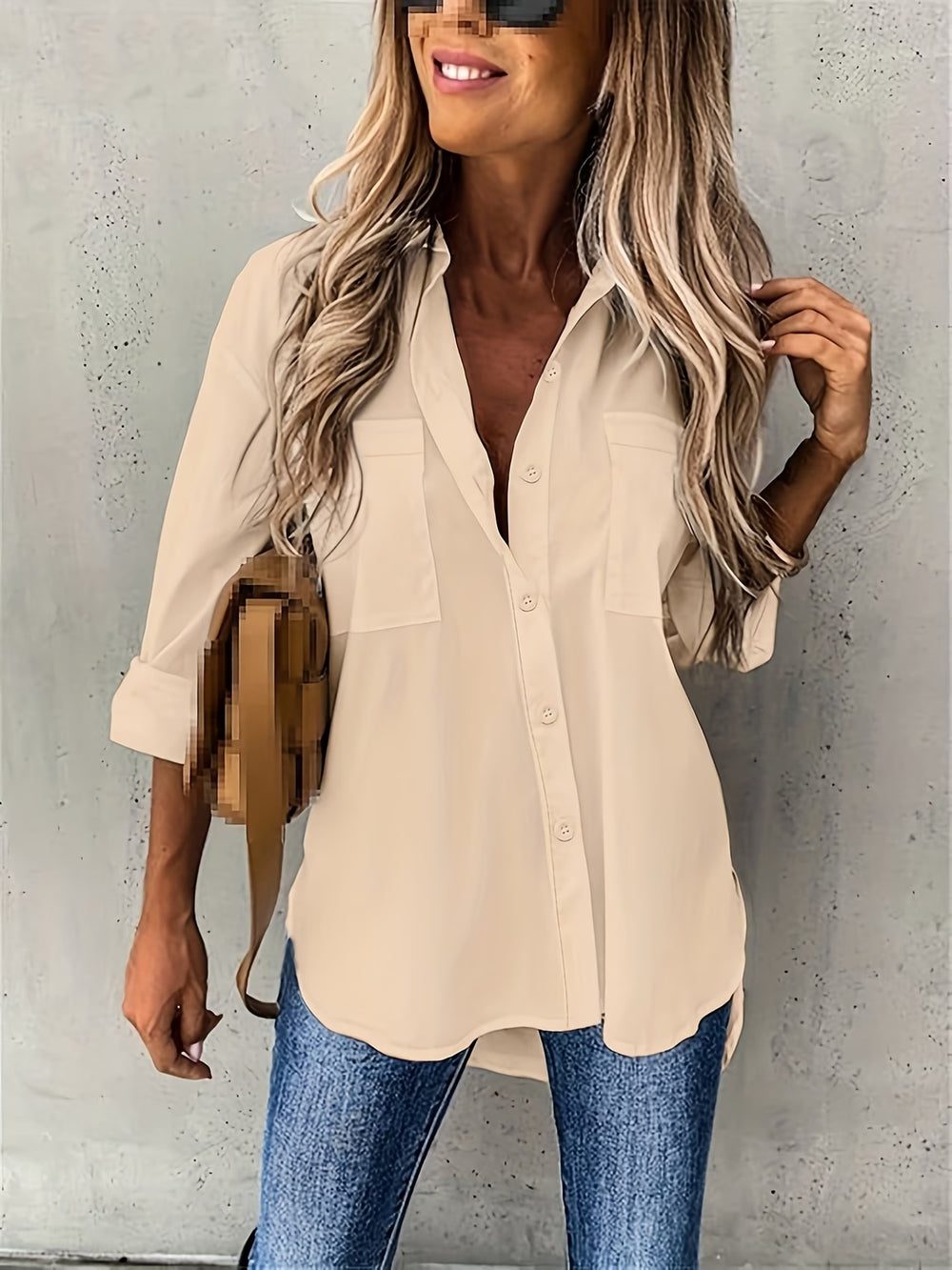 Close-up view of button-up long sleeve shirt showing collar and button placket construction