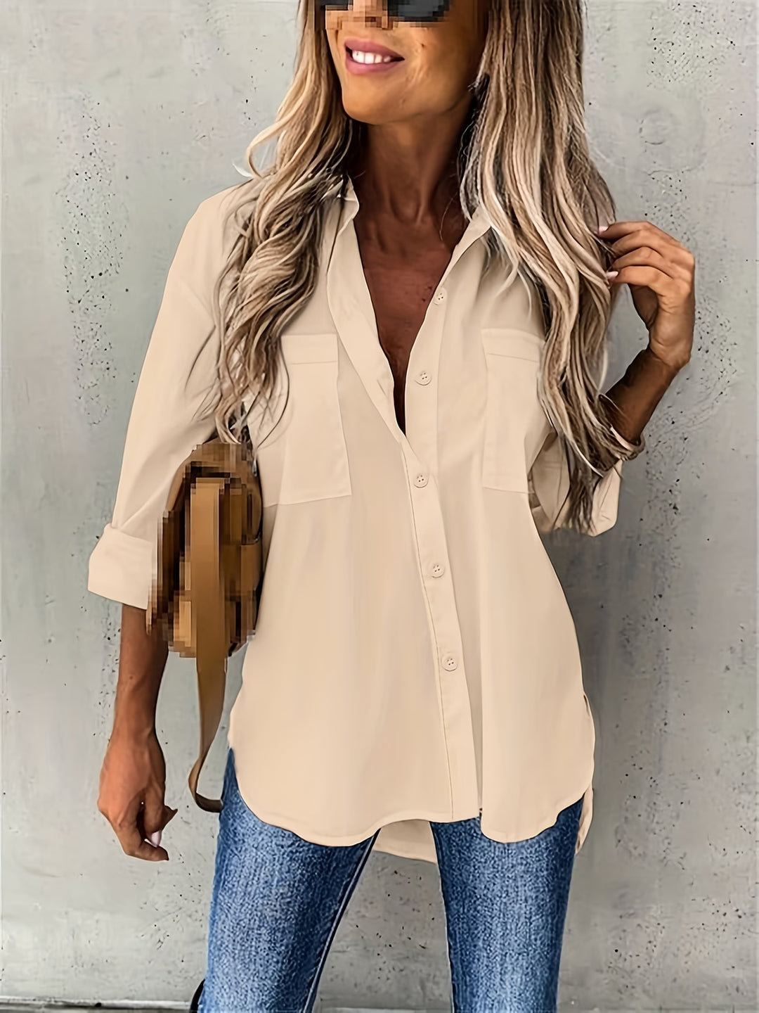 Close-up view of button-up long sleeve shirt showing collar and button placket construction
