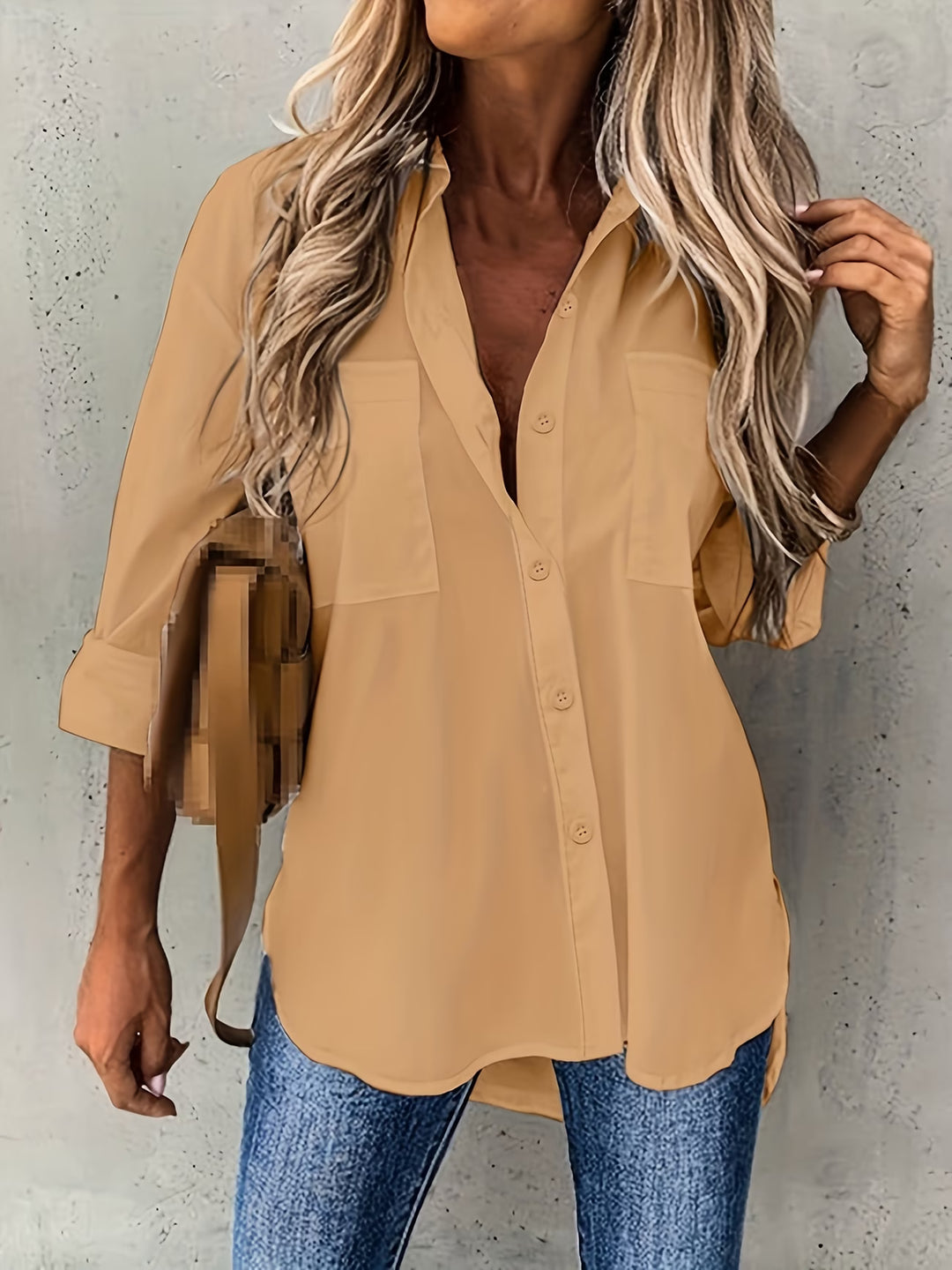 Detail shot of chest patch pocket on button-up long sleeve shirt
