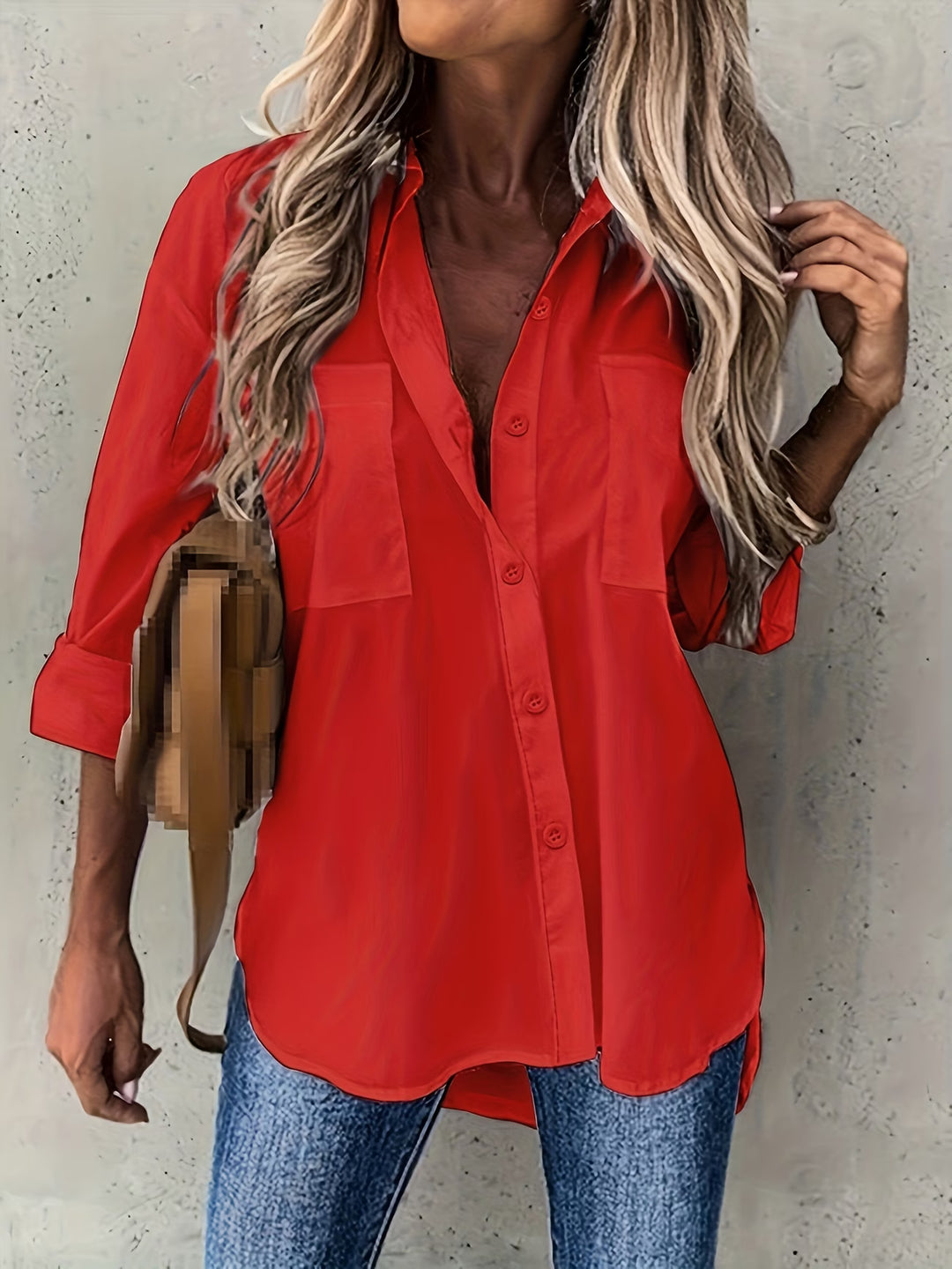 Woman styling button-up long sleeve shirt with blue jeans for casual look