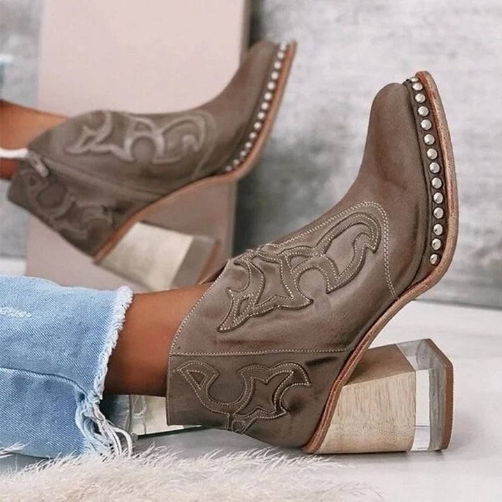 Side profile of women's block heel western boots showing contoured silhouette and embroidered pattern
