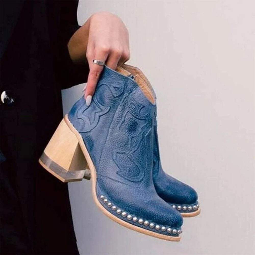 Women's western ankle boots with studded sole trim and structured upper in neutral tone