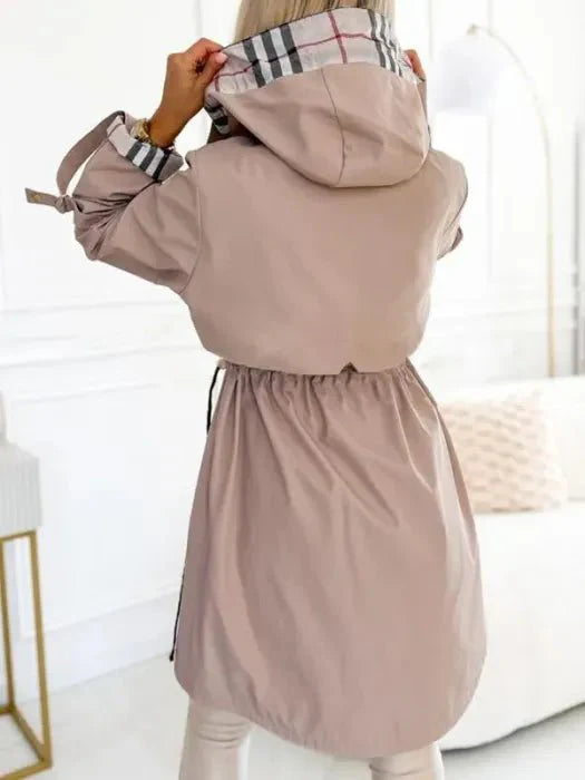 Women's waterproof trench coat styled with casual outfit showing versatile design