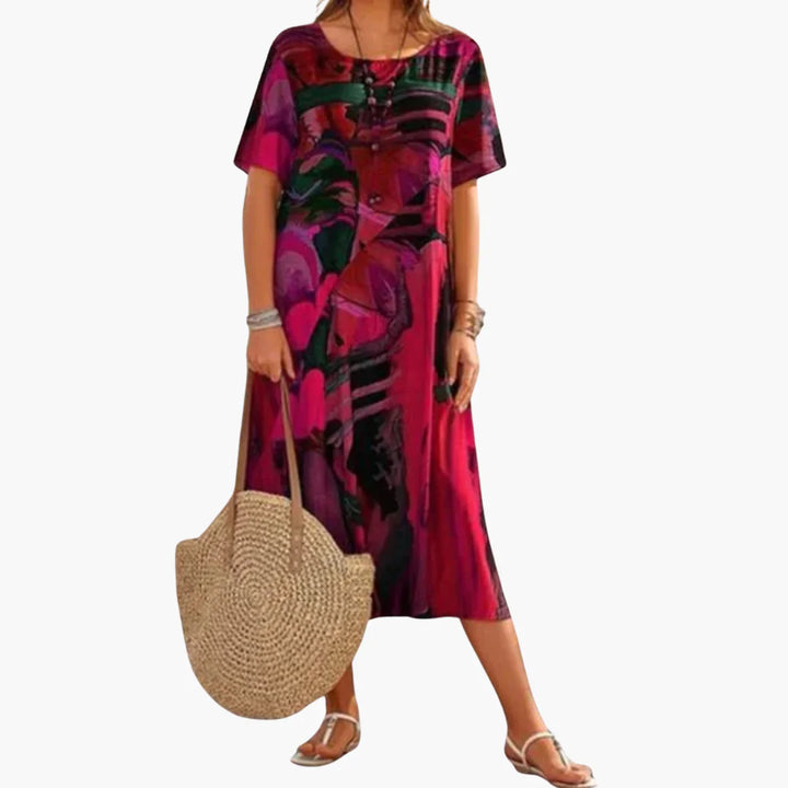 Women's relaxed fit midi dress featuring vibrant botanical print and short sleeves for garden parties