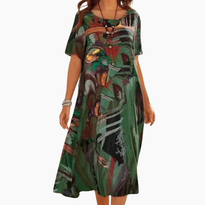 Full-length view of V-neck floral midi dress with loose silhouette and mid-calf hem