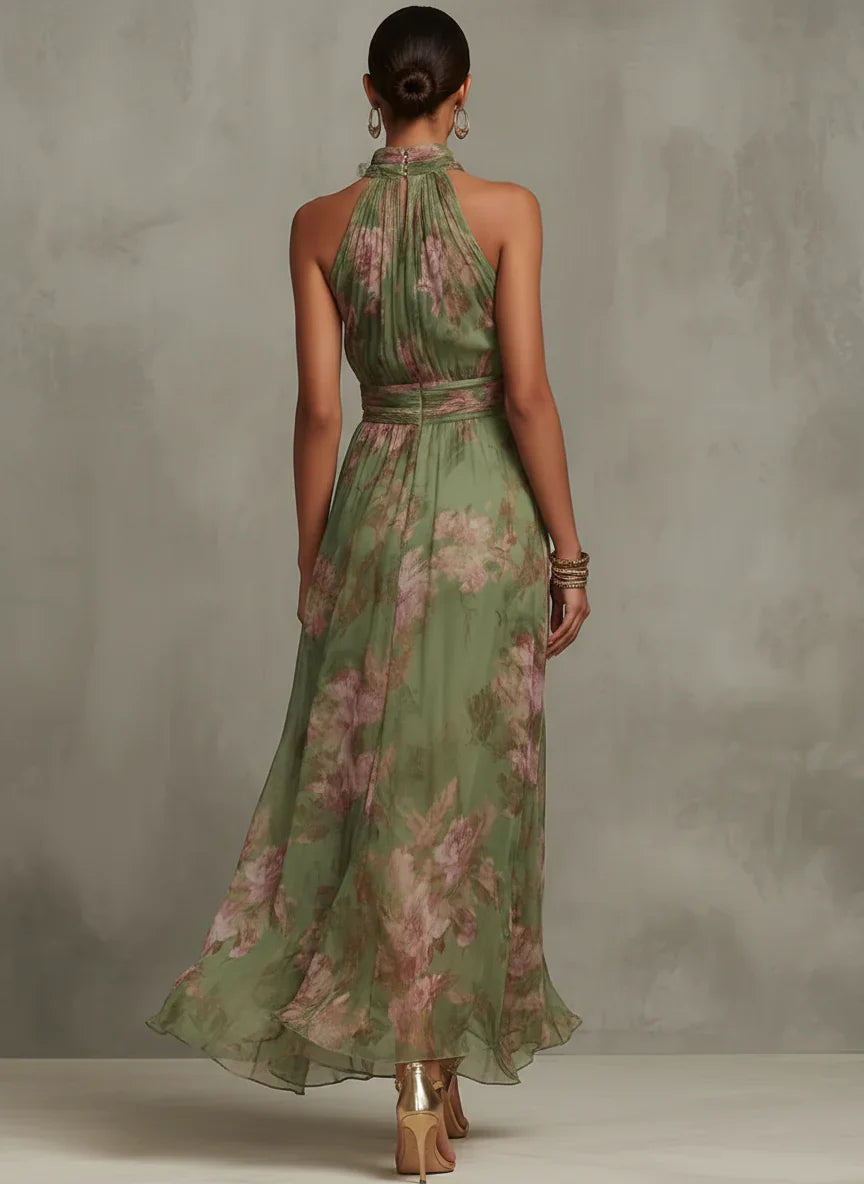 Side view of flowing floral halter maxi dress showing A-line skirt and cinched waist