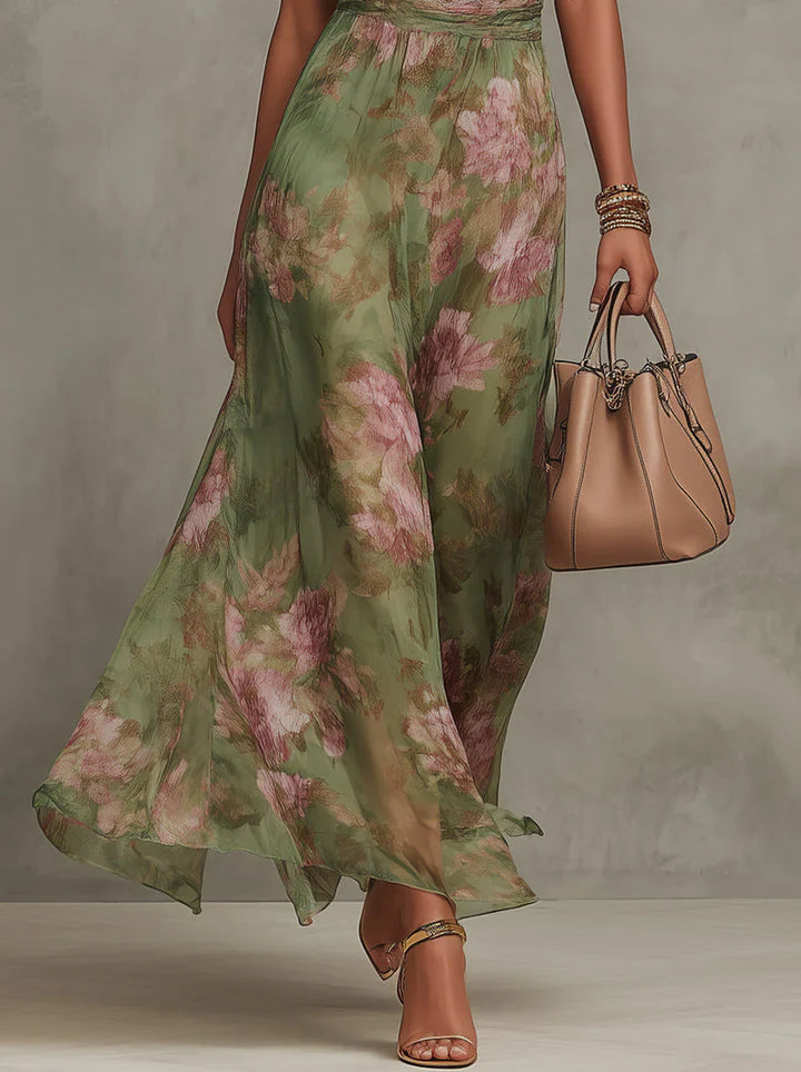 Full-length floral maxi dress with halter neck and lightweight chiffon drape