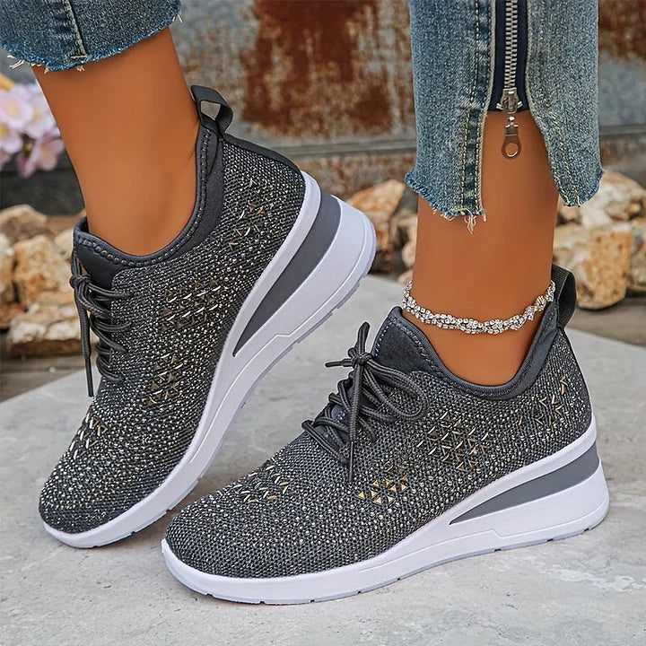 Side profile showing supportive sole and embellished vamp on women's orthopedic trainers