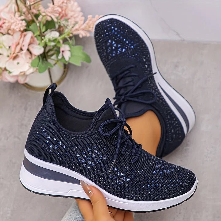 Side profile of women's orthopedic trainers featuring rhinestone detailing and slip-on design with laces