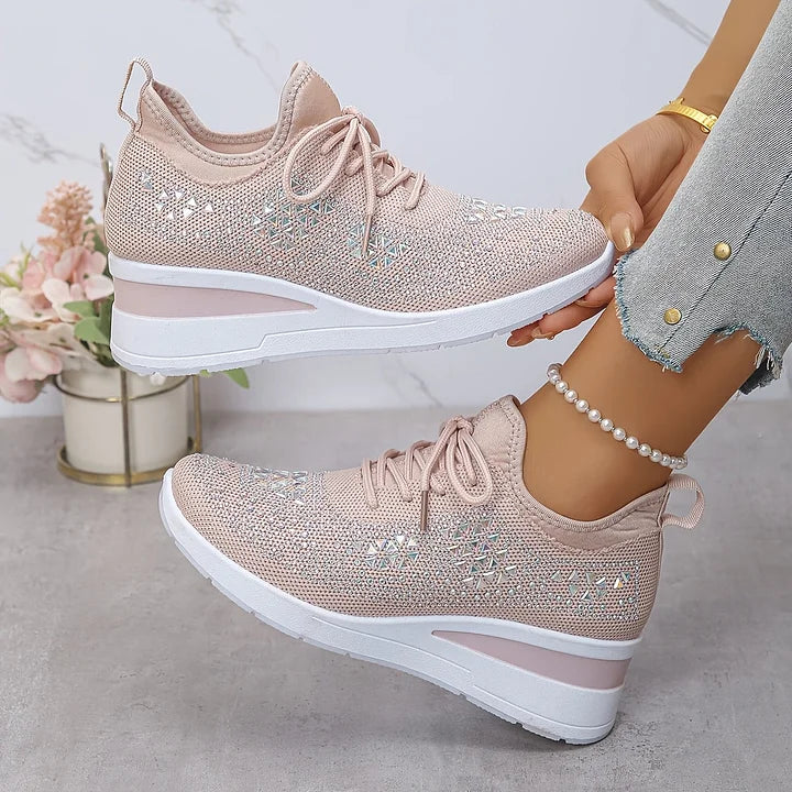 Detailed view of rhinestone embellishments and structured mesh fabric on orthopedic trainers