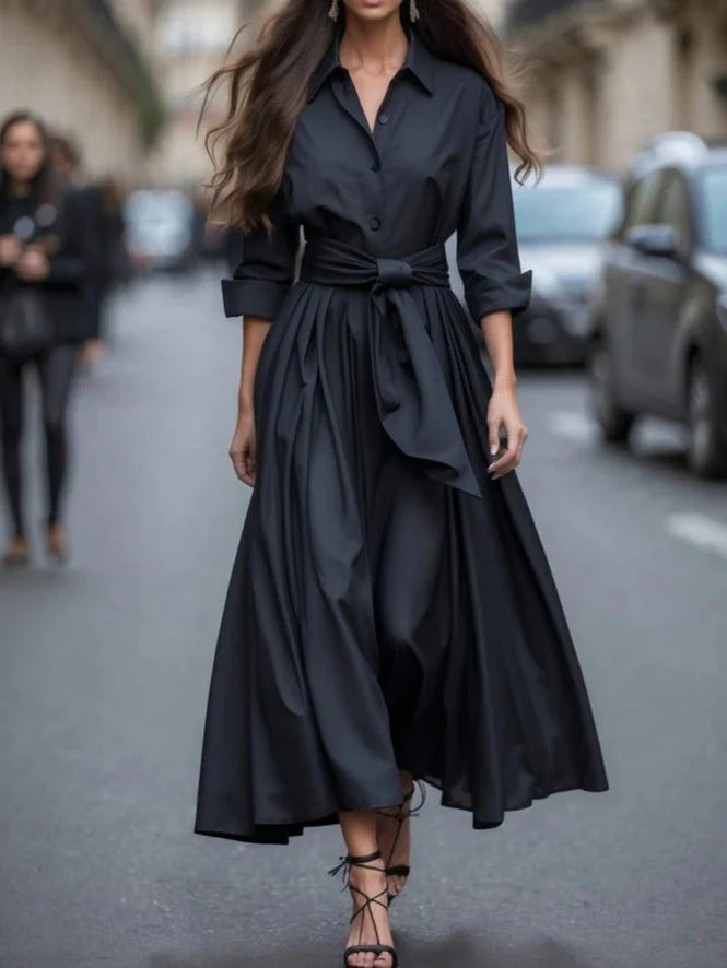 Side view of women's shirt maxi dress displaying floor-length hem and flowing silhouette