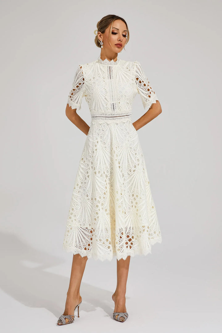 Back detail of lace midi dress showing openwork pattern and zip closure