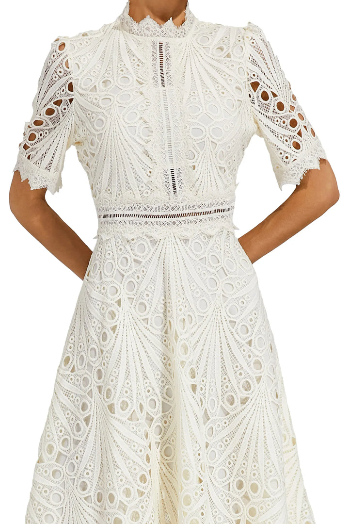 Full view of white lace midi dress with intricate detailing throughout