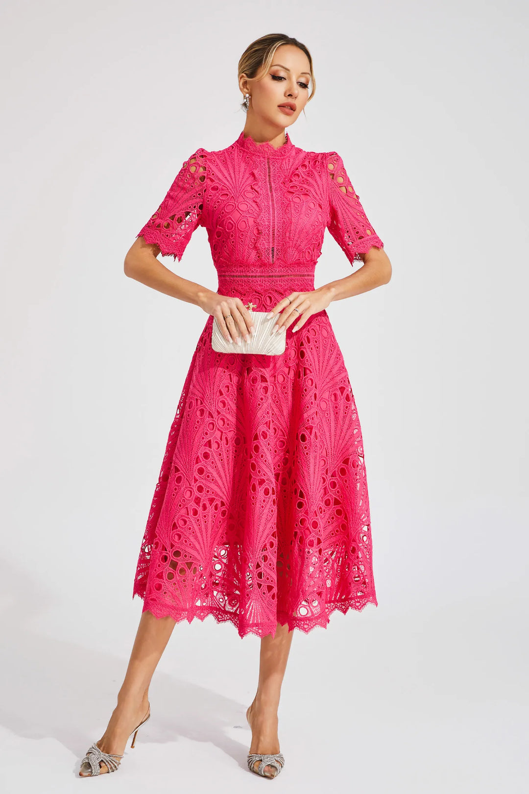 Side view of lace midi dress showing A-line skirt and short sleeves with scalloped edges
