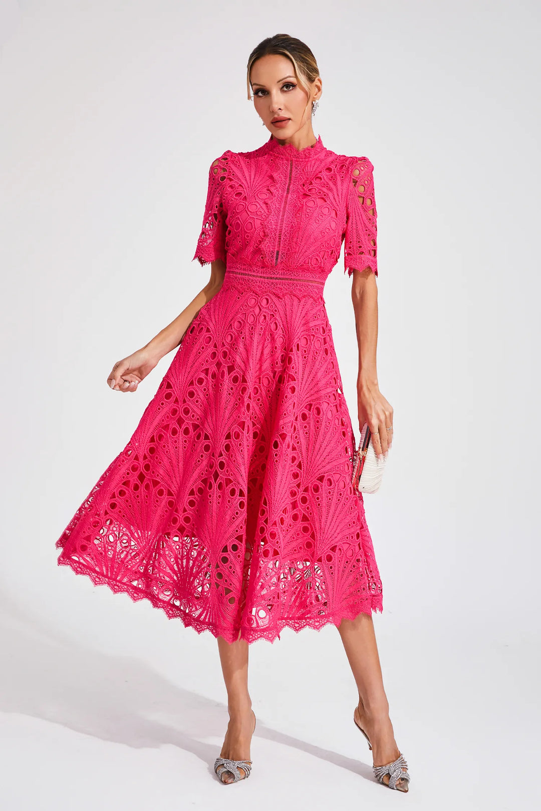 Close-up of intricate openwork lace detailing on midi dress bodice and sleeves
