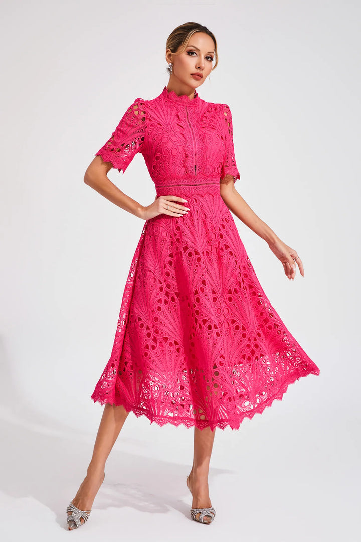 Woman in lace midi dress styled with heels for formal occasion wear