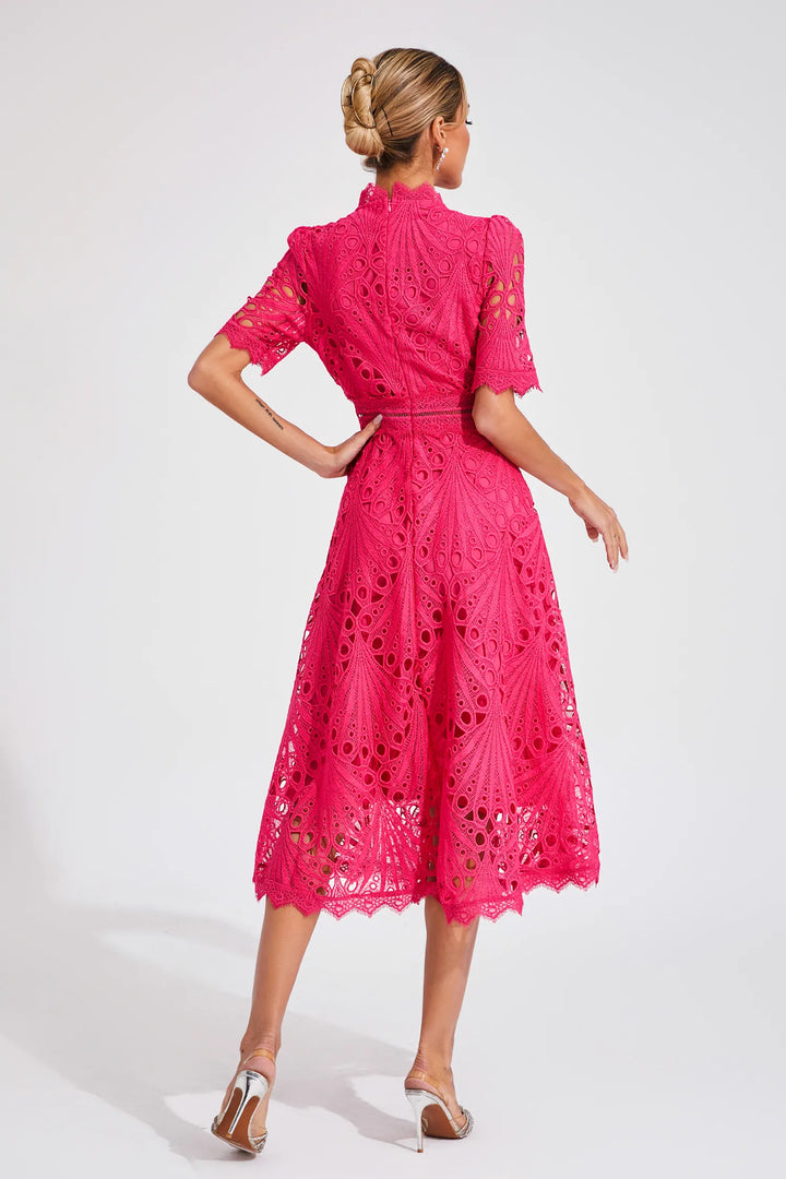Woman wearing lace midi dress for wedding guest or garden party outfit