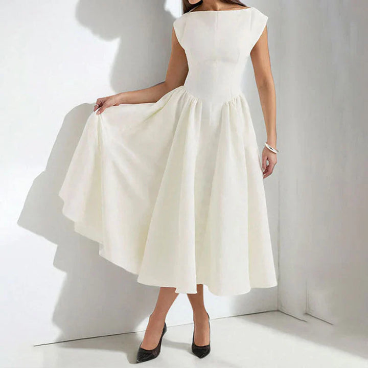 Women's Cap Sleeve Fit and Flare Midi Dress in white with round neckline and flowing skirt