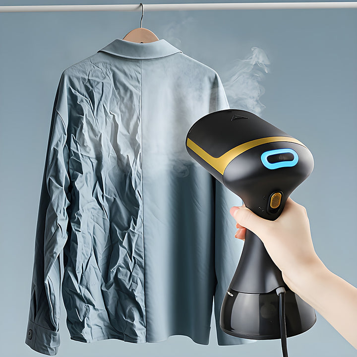 Garment steamer smoothing creases from a hanging shirt