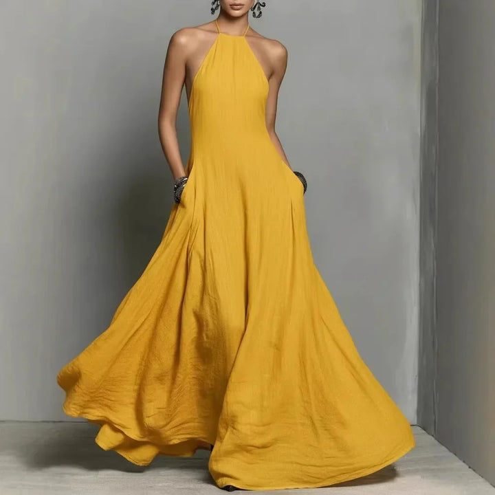 Flowing halter neck maxi dress with natural texture and elegant floor-length hem
