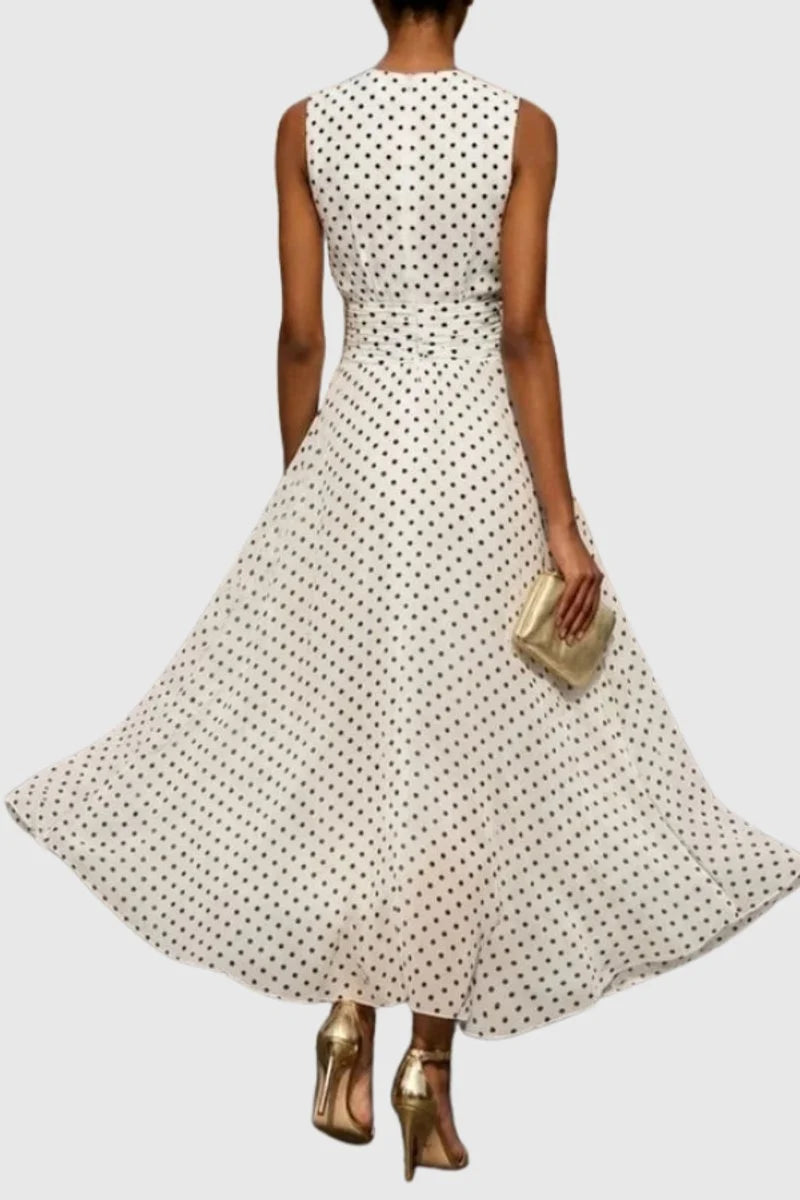 Front view of polka dot maxi dress showing A-line silhouette and sleeveless design