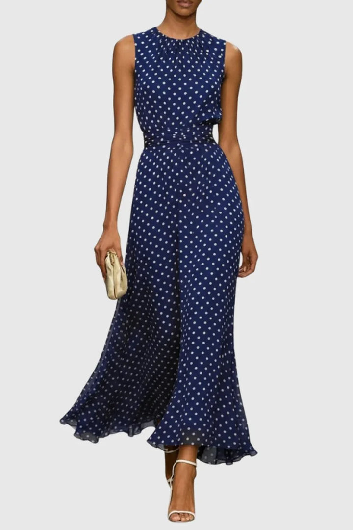 Back view of polka dot maxi dress showing graceful drape and ruffle hem