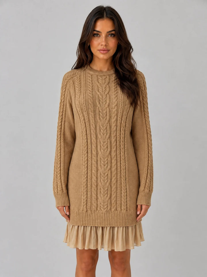Women's cable knit jumper dress styled with knee-high boots for autumn winter wear
