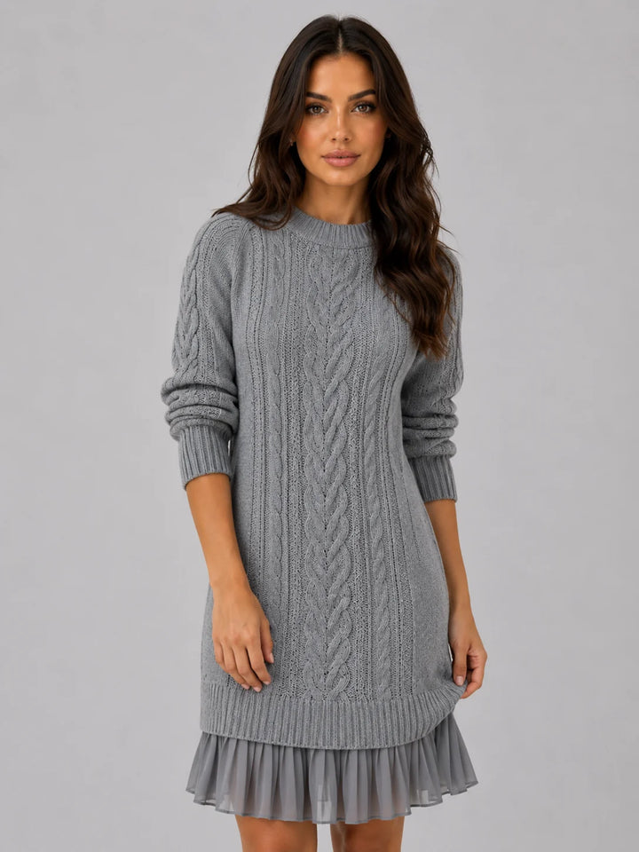 Detail shot of ribbed crew neckline and cable knit texture on mini dress