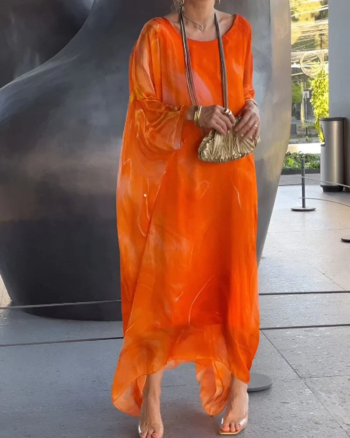 Woman styling marble print maxi dress with flat sandals for casual wear