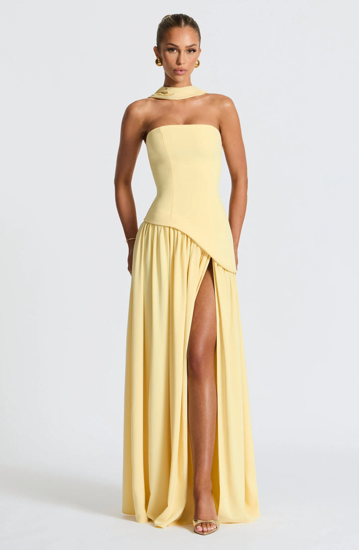 Model wearing the Strapless Maxi Dress with High Slit paired with heeled sandals