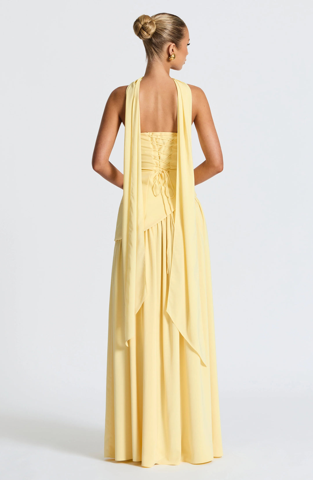 Movement shot showing the high slit and drape of the full-length skirt