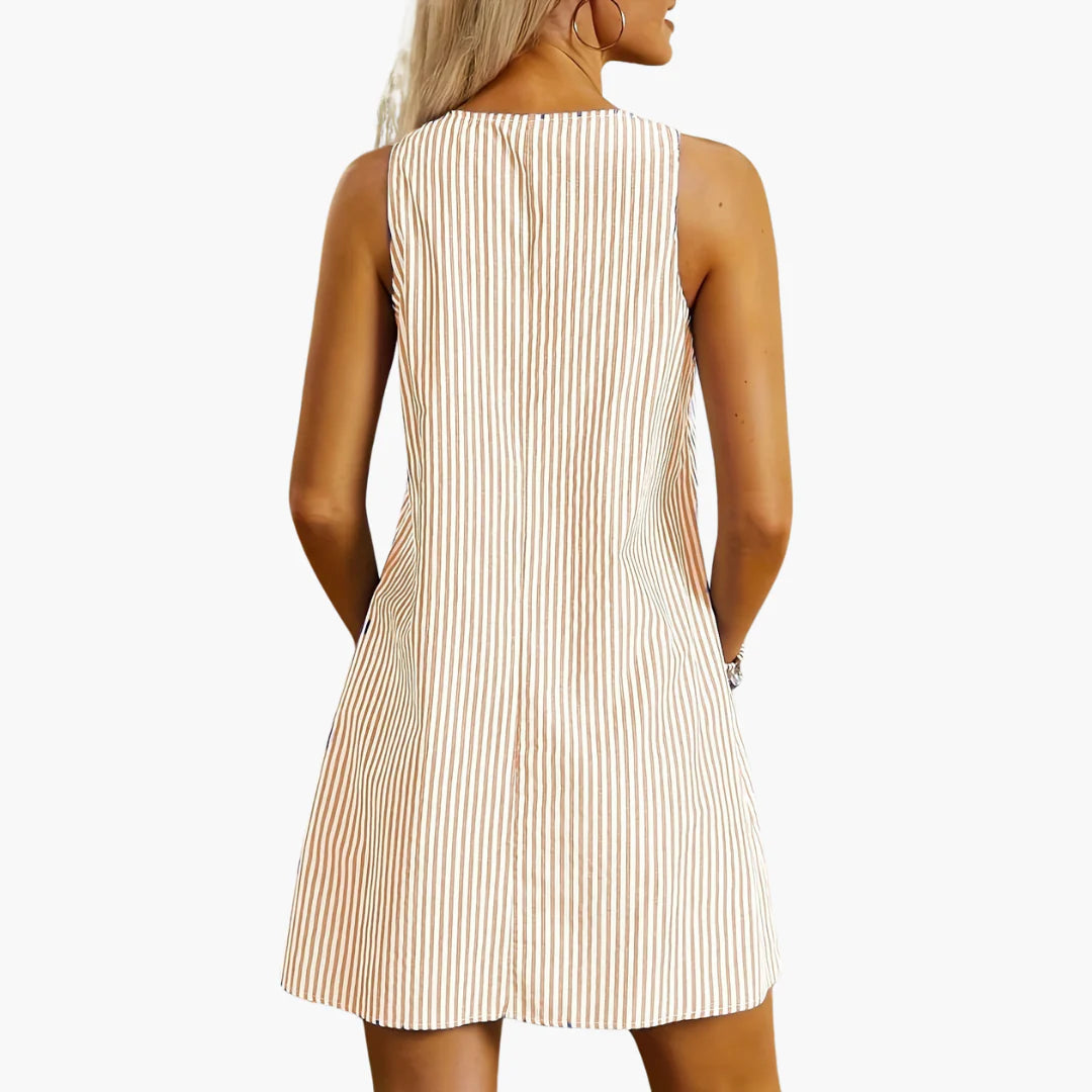 Striped mini dress with round neckline and practical hip-level pockets for everyday occasions